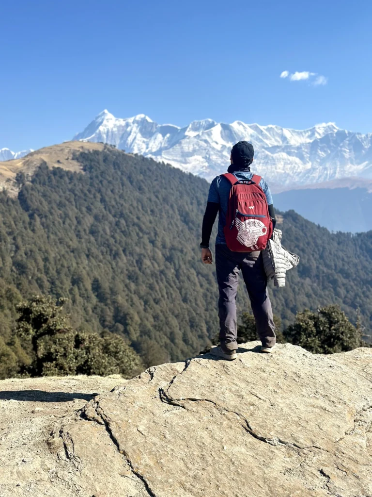 A person standing and looking for another personal hiking milestone