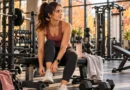 Adult following a fall gym routine with full-body strength training in a modern gym